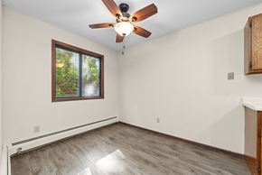 Stillwater apartment for rent - A room with a ceiling fan and a window.
