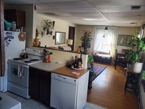 Minneapolis apartment for rent - A kitchen with a white refrigerator and a white dishwasher.