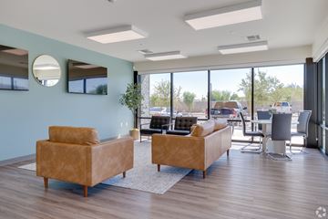 Phoenix apartment for rent - A living room with two couches and a large window.