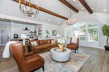Boerne apartment for rent - A modern living room with a brown leather chair and a white coffee table.