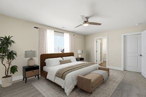 Findlay apartment for rent - A bedroom with a large bed and a ceiling fan.