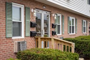 Defiance apartment for rent - A house with a white door and green shutters.