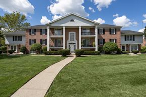 Toledo townhouse for rent - A large brick building with a white door and windows.