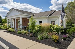 Sylvania apartment for rent - A white house with a flag on the front.