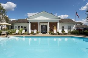 Sylvania apartment for rent - A white house with a pool in front.