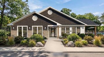 Findlay apartment for rent - A modern house with a black roof and white trim.