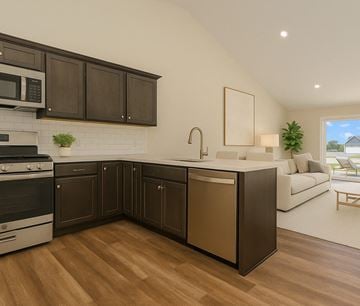 Findlay apartment for rent - A modern kitchen with dark brown cabinets and a white brick backsplash.