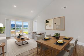 Findlay apartment for rent - A modern dining room with a wooden table set for four.