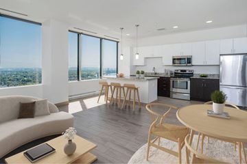 Toledo apartment for rent - A modern kitchen with a dining table and chairs.
