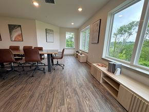 Bloomington apartment for rent - A conference room with a long table and chairs.