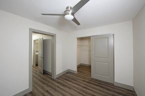 Columbus apartment for rent - a bedroom with a ceiling fan and a closet  at Gladstone Apartments, Columbus, 47201