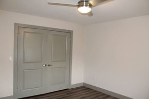 Plainfield apartment for rent - a room with a white door and a ceiling fan  at Haven Homes Apartments, LP, Plainfield, 46168