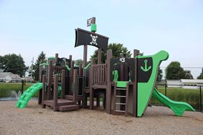 Daleville apartment for rent - a playground with a mix of wooden structures and green and brown equipment at Salem Place Apartments, Daleville, 47334