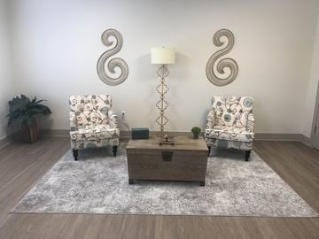Hobart apartment for rent - a living room with two chairs and a table