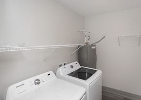 Fort Wayne apartment for rent - an empty laundry room with a washing machine and a dryer at Morada at Maysville, Fort Wayne, 46815