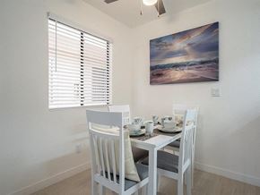 Phoenix apartment for rent - a dining room with a table and chairs and a window