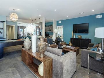 Carlsbad apartment for rent - a living room with couches and chairs and a television
