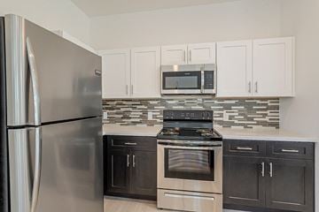 Buckeye apartment for rent - a kitchen with stainless steel appliances and white cabinets