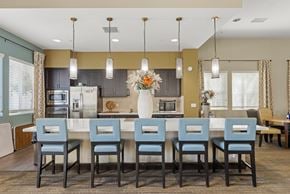 Chino apartment for rent - A kitchen with a table and chairs in the foreground.