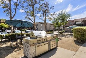 Chino apartment for rent - A BBQ grill is in the middle of a courtyard.