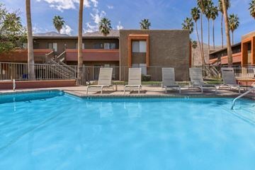 Palm Springs apartment for rent - the swimming pool at the resort combines a resort style pool with lounge chairs