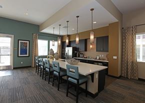 Chino apartment for rent - A kitchen with a long table and chairs.