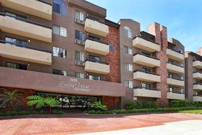 Los Angeles apartment for rent - an apartment building with a brick facade and a sign that reads the sugar loft