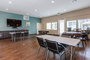 Chino apartment for rent - a dining room with a table and chairs and a tv
