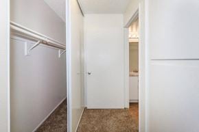 Chino apartment for rent - a bedroom with a closet and a white door