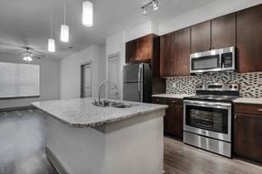 Arlington apartment for rent - a kitchen with a counter top and a sink
