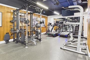 Los Angeles apartment for rent - A gym with a variety of equipment including treadmills and weight machines.