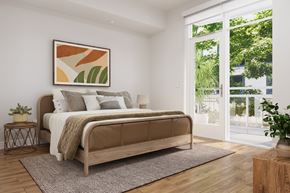 Los Angeles apartment for rent - A bedroom with a large bed and a painting on the wall.