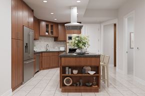 Los Angeles apartment for rent - A kitchen with wooden cabinets and a marble countertop.