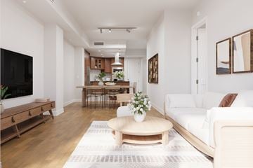 Los Angeles apartment for rent - A living room with a white couch and a wooden coffee table.