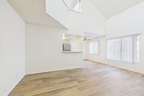 North Hollywood apartment for rent - A spacious room with wooden flooring and a skylight.