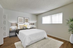 Los Angeles apartment for rent - A bedroom with a white bed and a white rug.