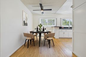 Sherman Oaks apartment for rent - A dining room with a table and chairs.
