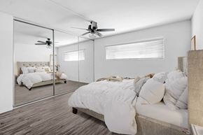 Los Angeles apartment for rent - a bedroom with a large mirror and a bed