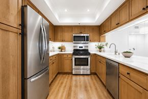 West Hollywood apartment for rent - A modern kitchen with wooden cabinets and stainless steel appliances.
