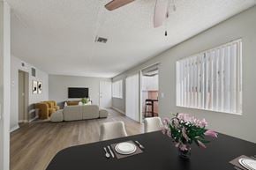 North Hills apartment for rent - A dining room with a black table set for two.