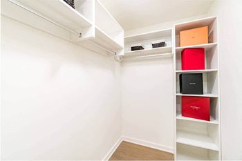 Built-in spacious walk-in closets with sleek bi-pass sliding doors