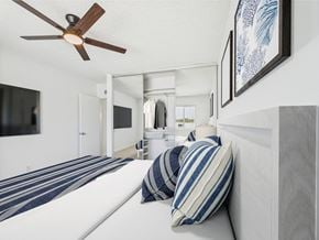 Santa Monica apartment for rent - A bedroom with a bed, pillows, and a ceiling fan.