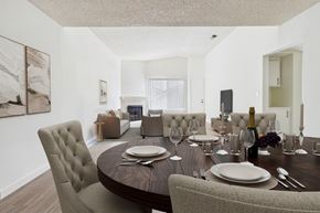 Northridge apartment for rent - A dining room with a round table set for two.