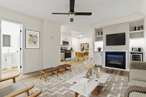 Santa Monica apartment for rent - A living room with a fireplace and a television.