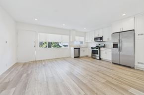 Los Angeles apartment for rent - A kitchen with white cabinets and stainless steel appliances.