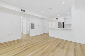 Winnetka apartment for rent - A spacious room with wooden flooring and white walls.