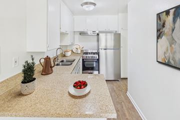 Torrance apartment for rent - A kitchen with a refrigerator, oven, and sink.