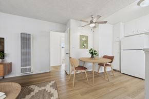 Canoga Park apartment for rent - A dining room with a table set for two and a ceiling fan.