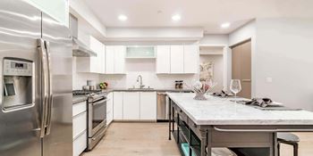Stainless-steel dishwasher, oven, microwave drawer and range hood
