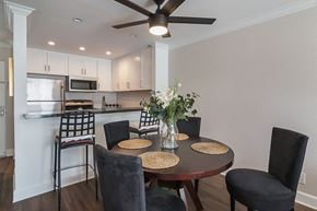 Los Angeles apartment for rent - A dining room with a round table and chairs.